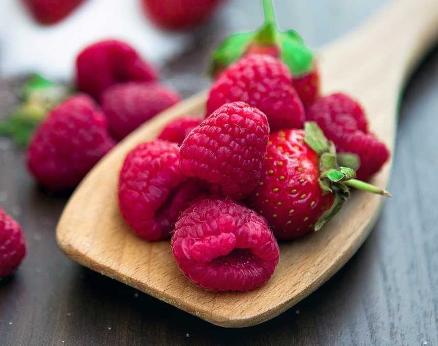 Picture of raspberries on a serving spoon.