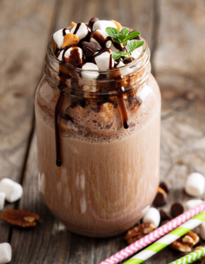 Picture of a chocolate mint smoothie with marshmallows and chocolate syrup.