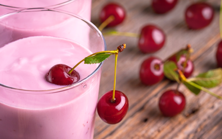 Picture of two glasses of cherry smoothie.